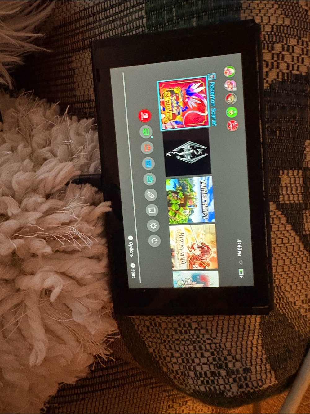 Nintendo Black Tablet-Style Handheld Console with Game Menu Display